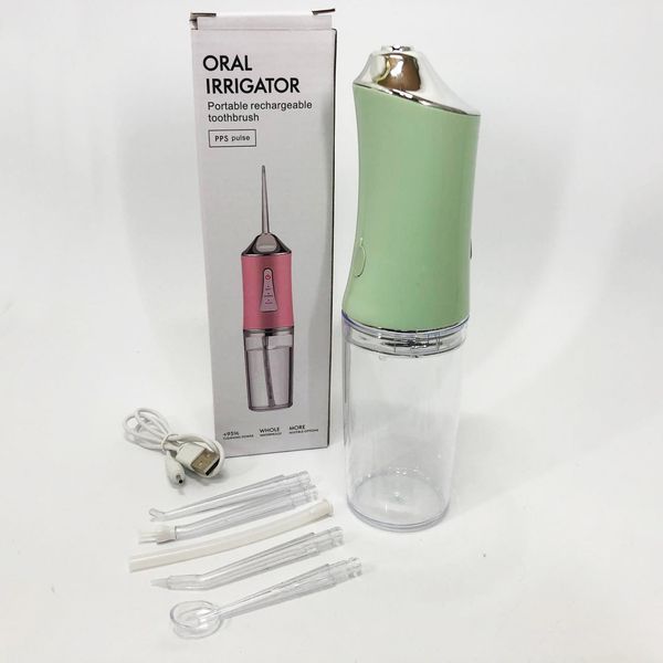 Іригатор для чищення зубів та порожнини рота Oral Irrigator з акумулятором та змінними насадками. Колір: зелений m12kr4s952 фото